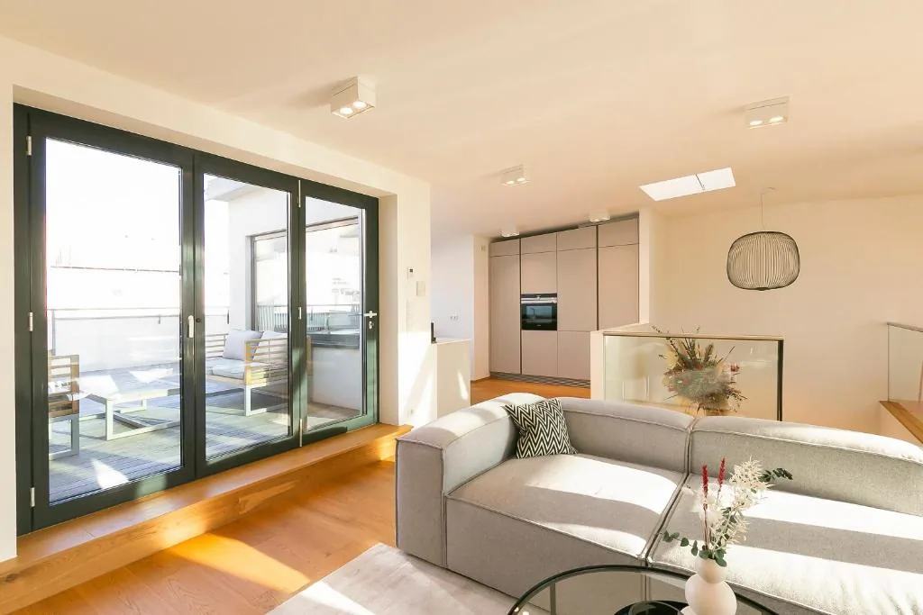 Penthouse — living room with terrace doors open